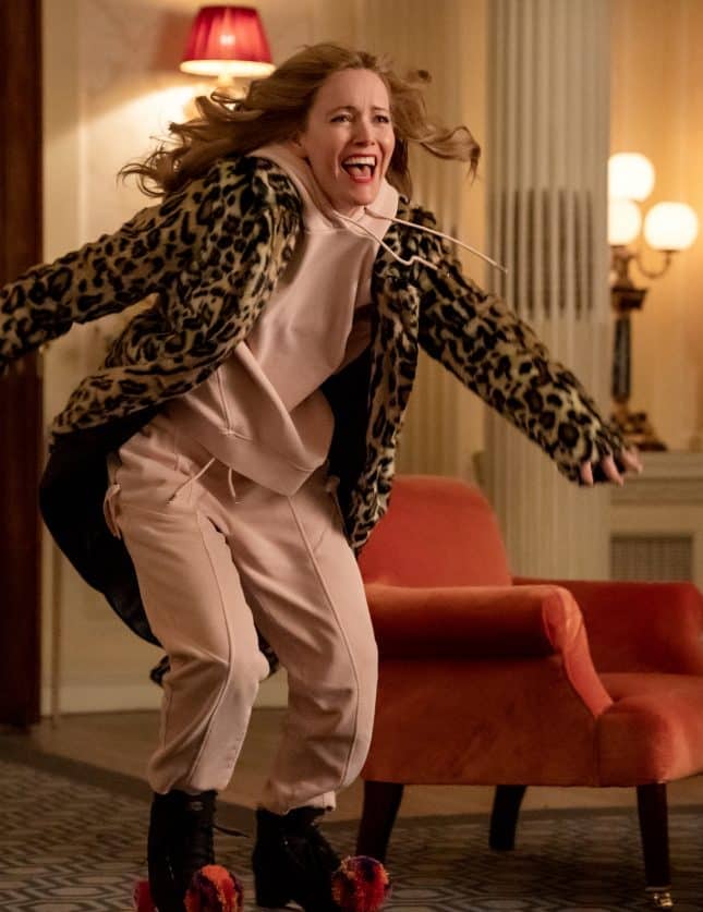 A woman smiling and dancing in Hedsor