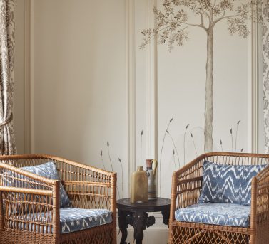 The Mont Rochelle Suite showing two wicker chairs and blue cushions