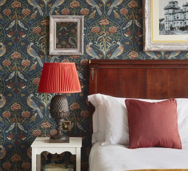 Guest accommodation of Hedsor wedding venue showing a bedside table and bed